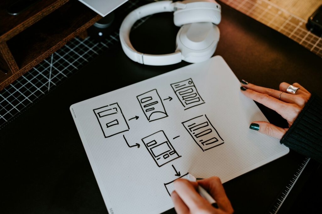 a person is writing on a piece of paper